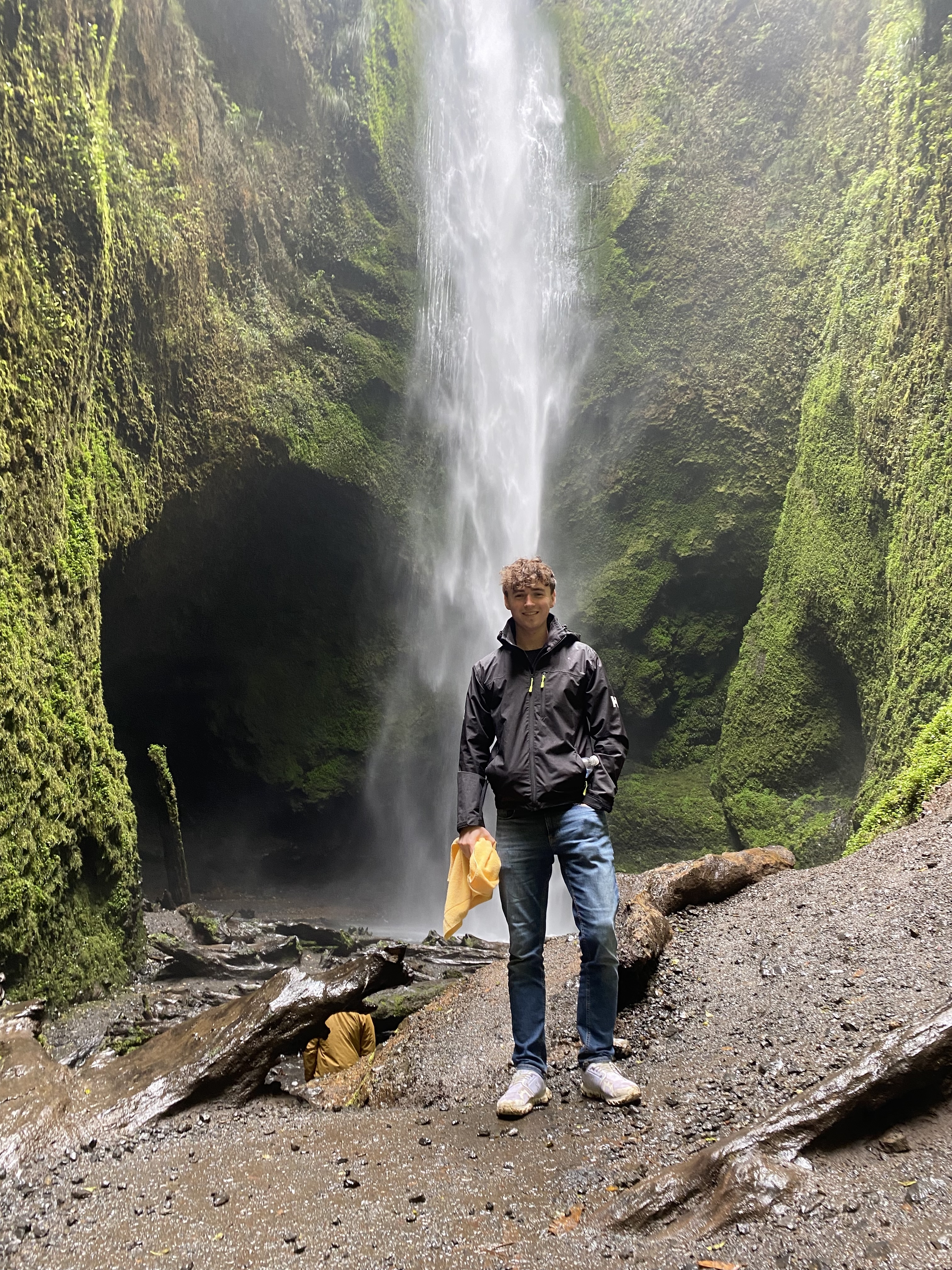 Standing by a waterfall in Patagonia